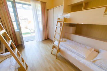 Beds in the bunk bed room at JUFA Pöllau