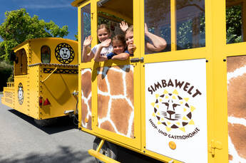 Children on a Scenic Train Ride at Tierwelt Herberstein Children on a Scenic Train Ride at Tierwelt Herberstein