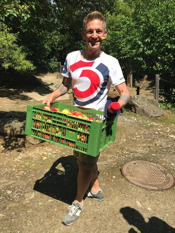 Andi Knoll with a basket of apples at Herberstein Wildlife Park